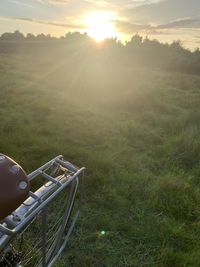 Scenic view of land against sky during sunset
