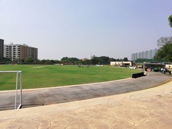 Park in city against clear sky