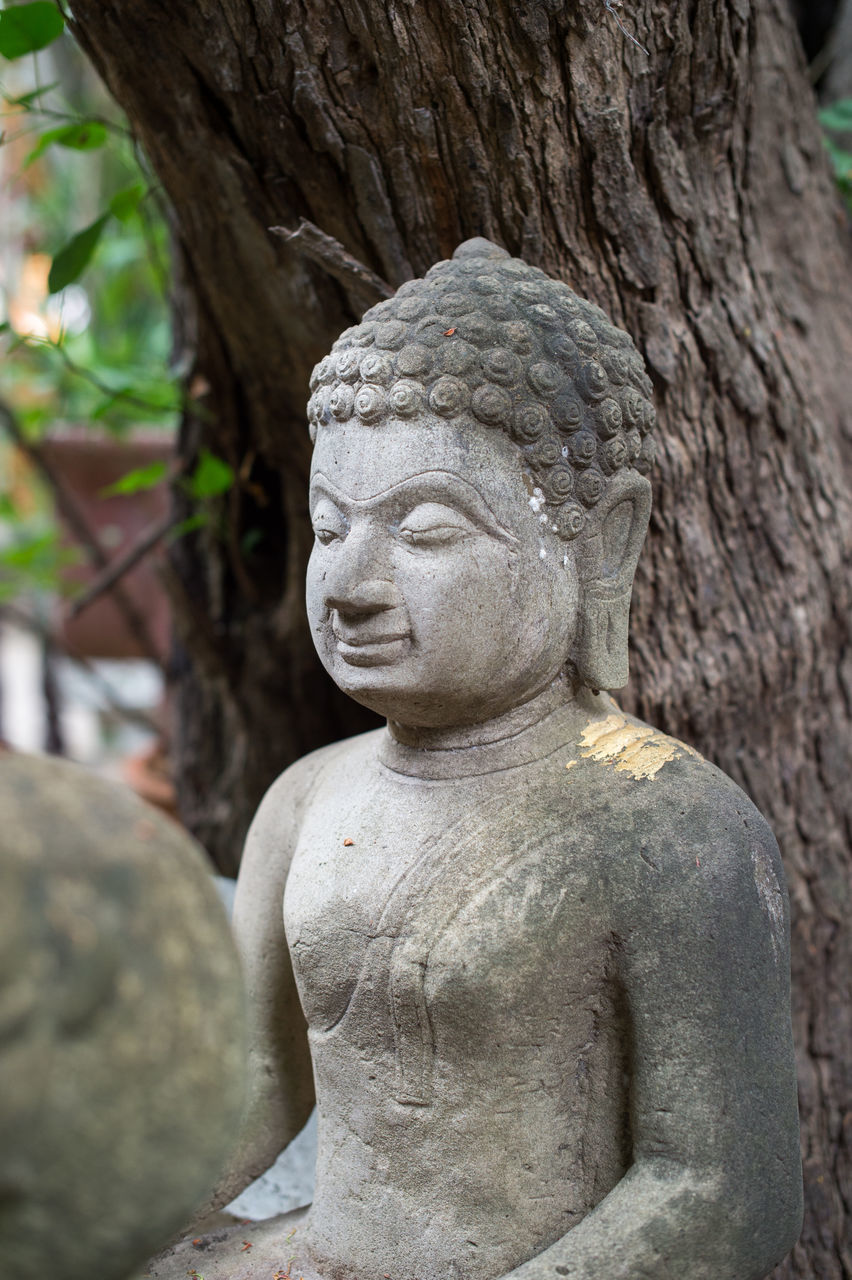 CLOSE-UP OF OLD STATUE