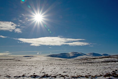 Scenic view of snowcapped scottish mountain morven against sky on sunny day