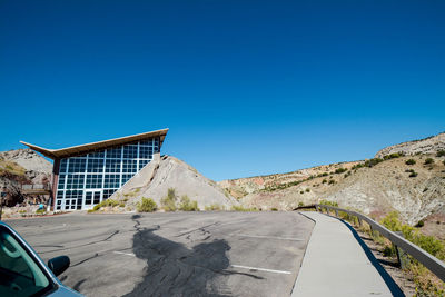 Scenic view of mountain against clear blue sky