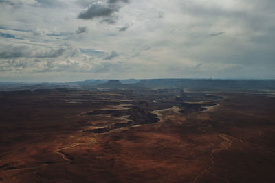 Aerial view of landscape against cloudy sky