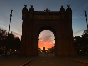 Silhouette of building at sunset