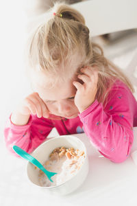 Close-up of girl eating food