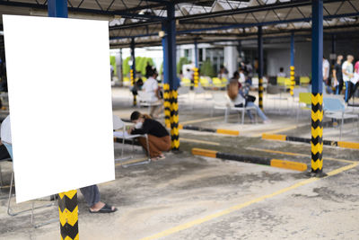 People standing on railroad station platform