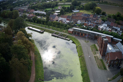 High angle view of train amidst buildings in city