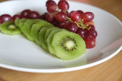 Close-up of fruits in plate on table