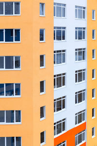 New multistory building . double glazed windows in a row . new residential house in the city