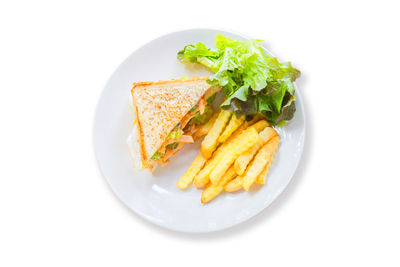 High angle view of food in plate against white background