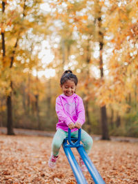 Portrait of girl in park during autumn