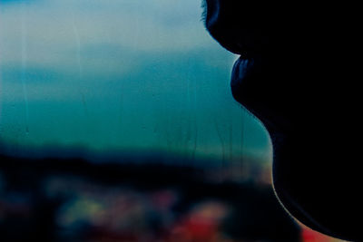 Portrait of man seen through window