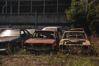 Abandoned cars on land