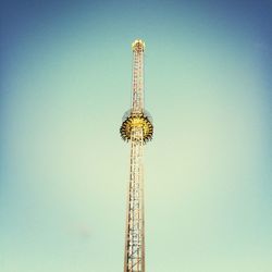 Low angle view of tower against blue sky