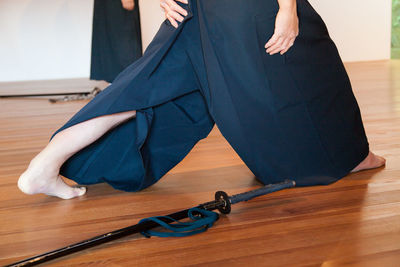 Close-up of shoes on hardwood floor