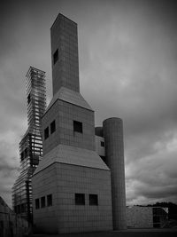 Low angle view of modern buildings against sky in city