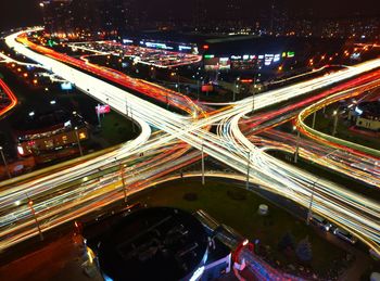 High angle view of light trails on road at night