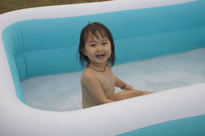 Portrait of smiling girl in swimming pool