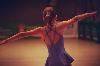 Rear view of girl dancing