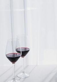 Close-up of wineglass on table