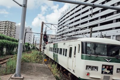 Train on railroad tracks against sky