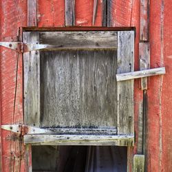 Close-up of wood against brick wall