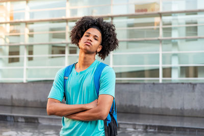 Portrait of young man standing outdoors