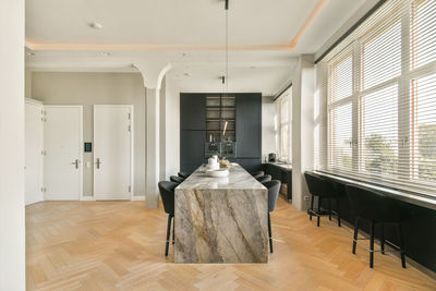 Rear view of woman standing in corridor