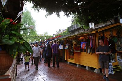 People walking on street in city