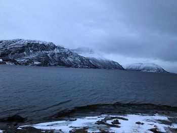 Scenic view of frozen lake against sky