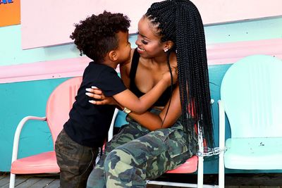 Mother and son embracing on chair