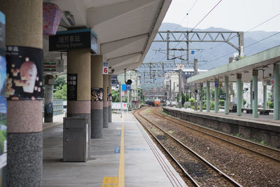 Train on railroad station platform against sky