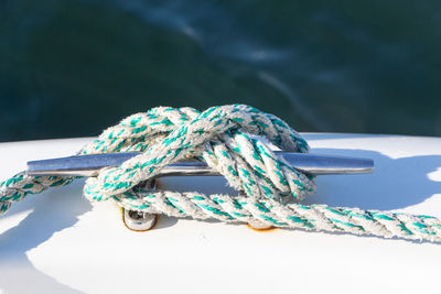 Close-up of rope tied on metal