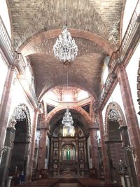 Low angle view of ornate ceiling in temple