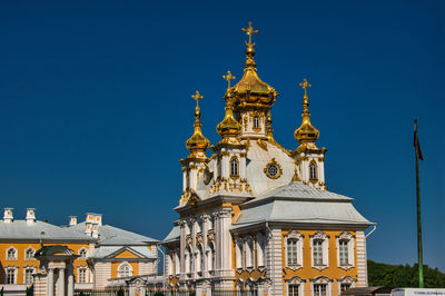 Low angle view of building against blue sky