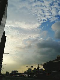 Buildings against cloudy sky