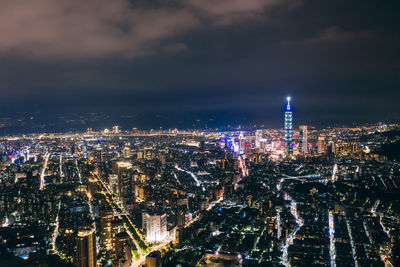 High angle view of illuminated city buildings at night