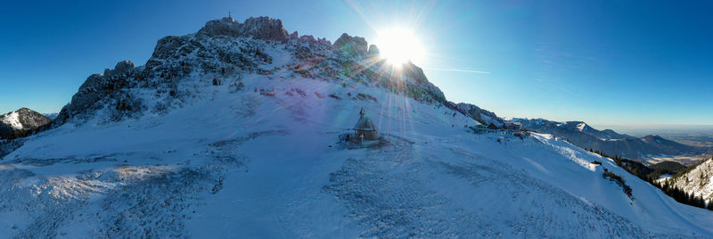 Panoramic view of snowcapped mountains against sky