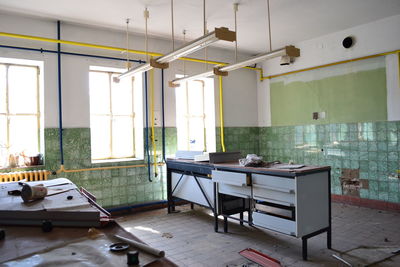 Empty chairs and tables in room