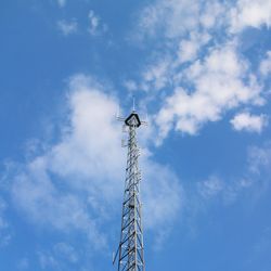 Low angle view of communications tower against sky