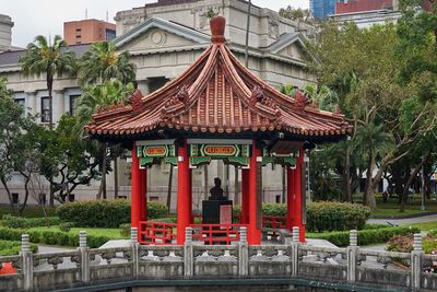 Red temple against building