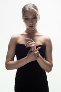 Portrait of a beautiful young woman over white background