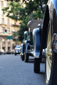 Close-up of car on road