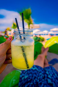 Close-up of hand holding drink