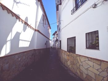 Street amidst buildings against sky