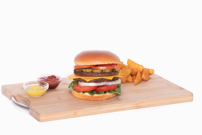 Chocolate cake on table against white background