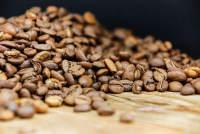 Close-up of coffee beans on table