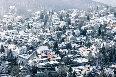 High angle view of houses in city during winter