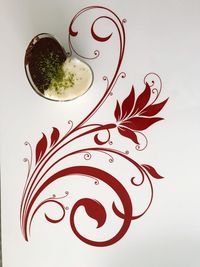 High angle view of drink against white background