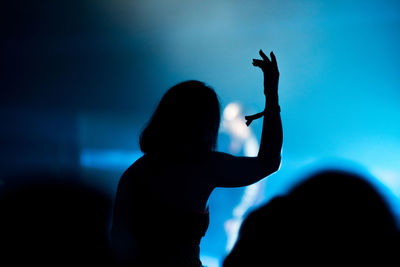 Silhouette people enjoying at music concert