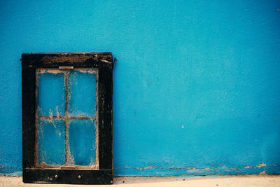 Close-up of blue window on wall